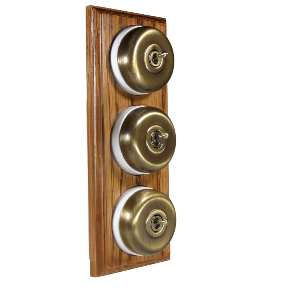 Period Smooth Antique Brass Dome Triple Dolly Light Switch Medium Oak White Vertical