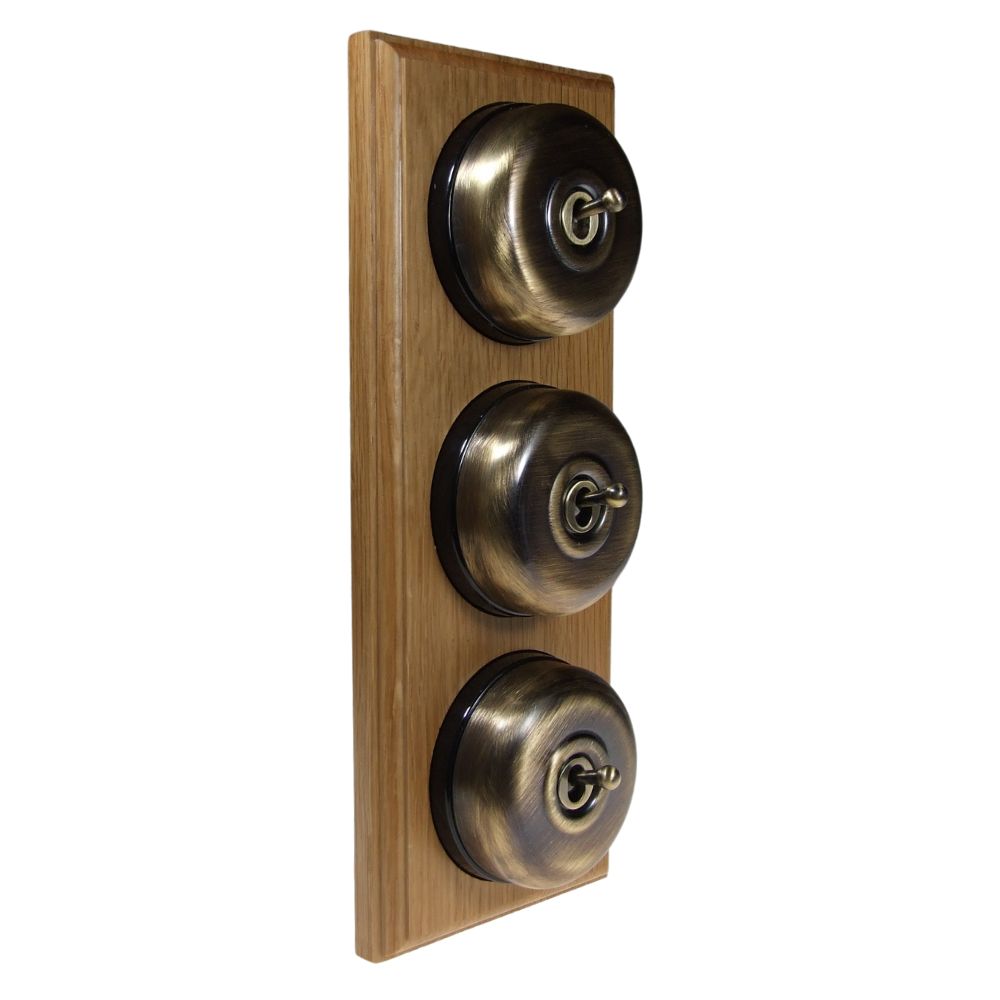 Period Smooth Antique Brass Dome Triple Dolly Light Switch Medium Oak Black Vertical