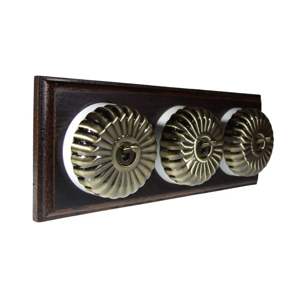Period Fluted Antique Brass Dome Triple Dolly Light Switch Dark Oak White Horizontal