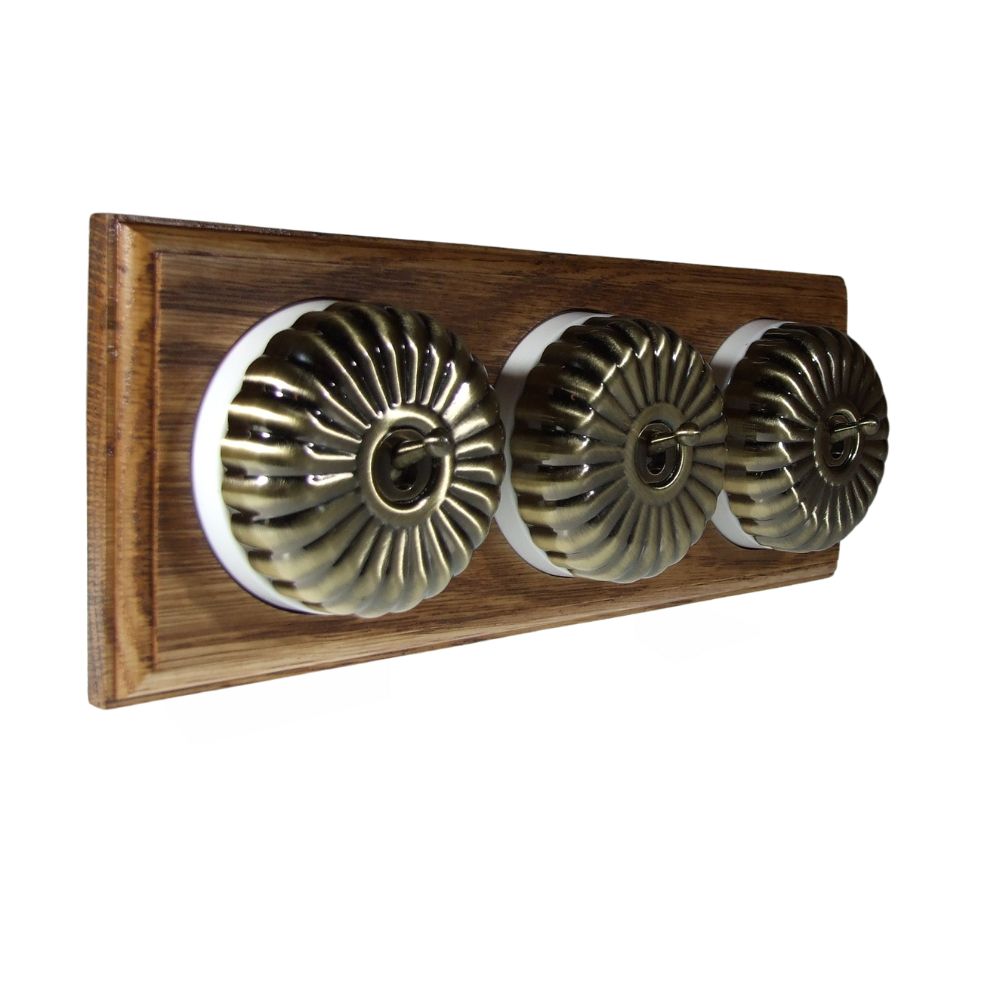 Period Fluted Antique Brass Dome Triple Dolly Light Switch Medium Oak White Horizontal