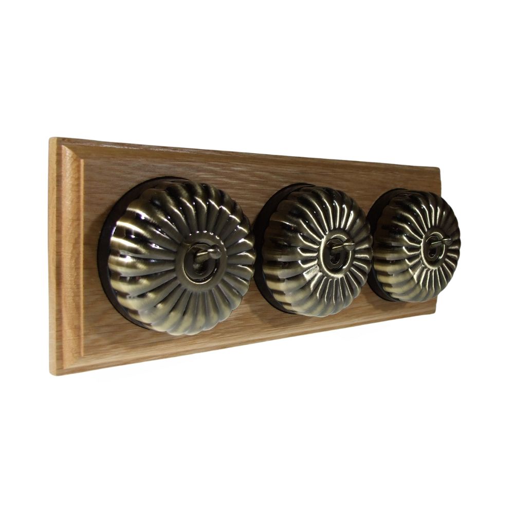 Period Fluted Antique Brass Dome Triple Dolly Light Switch Oak Black Horizontal