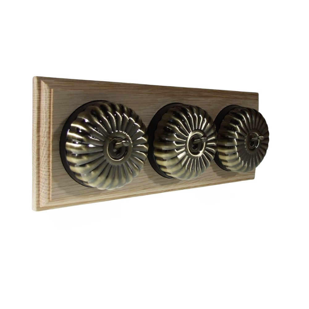 Period Fluted Antique Brass Dome Triple Dolly Light Switch Unfinished Oak Black Horizontal