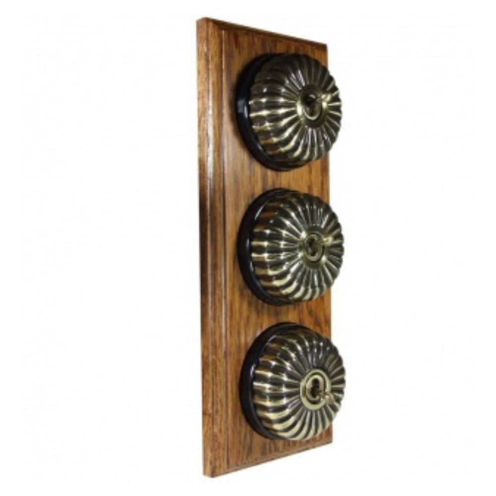 Period Fluted Antique Brass Dome Triple Dolly Light Switch Medium Oak Black Vertical
