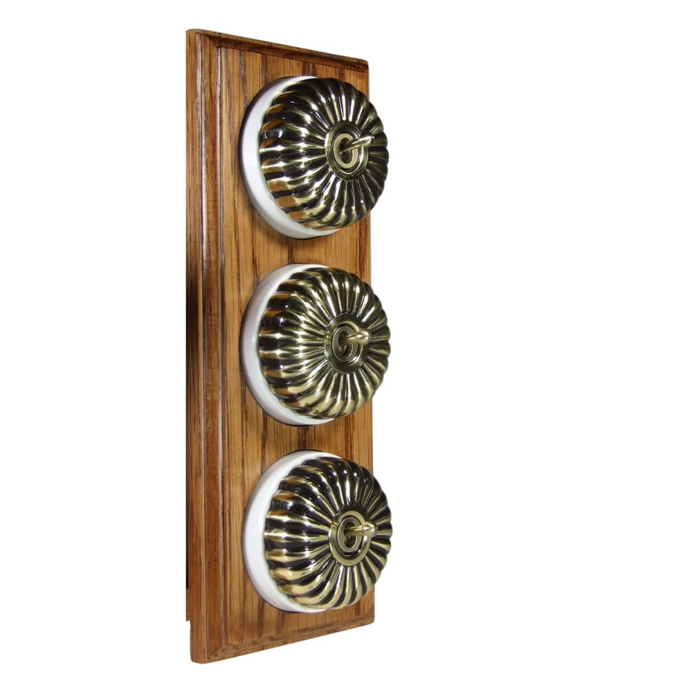 Period Fluted Antique Brass Dome Triple Dolly Light Switch Medium Oak White Vertical