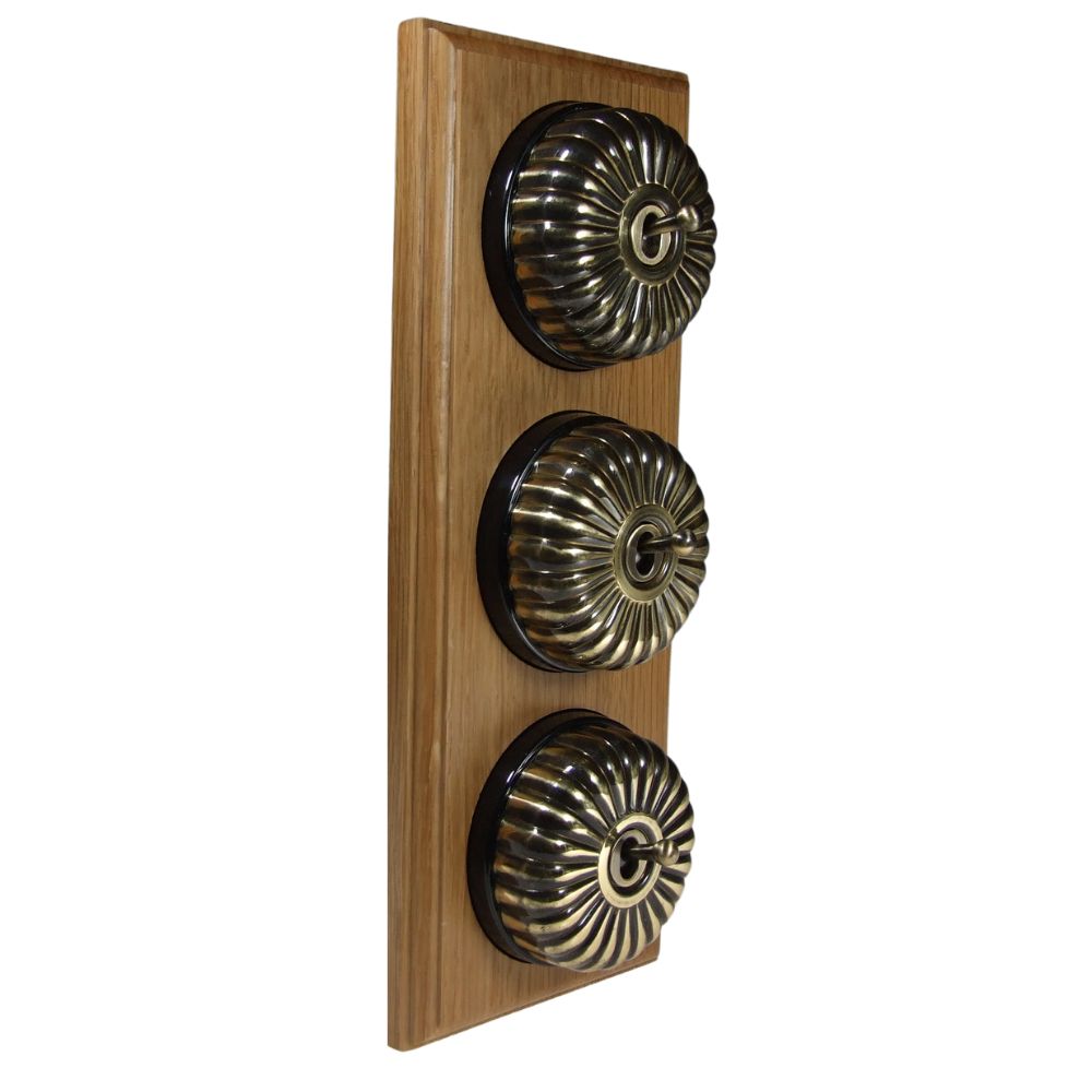 Period Fluted Antique Brass Dome Triple Dolly Light Switch Medium Oak Black Vertical