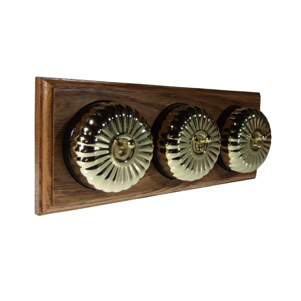 Period Fluted Polished Brass Dome Triple Dolly Light Switch Medium Oak Black Horizontal