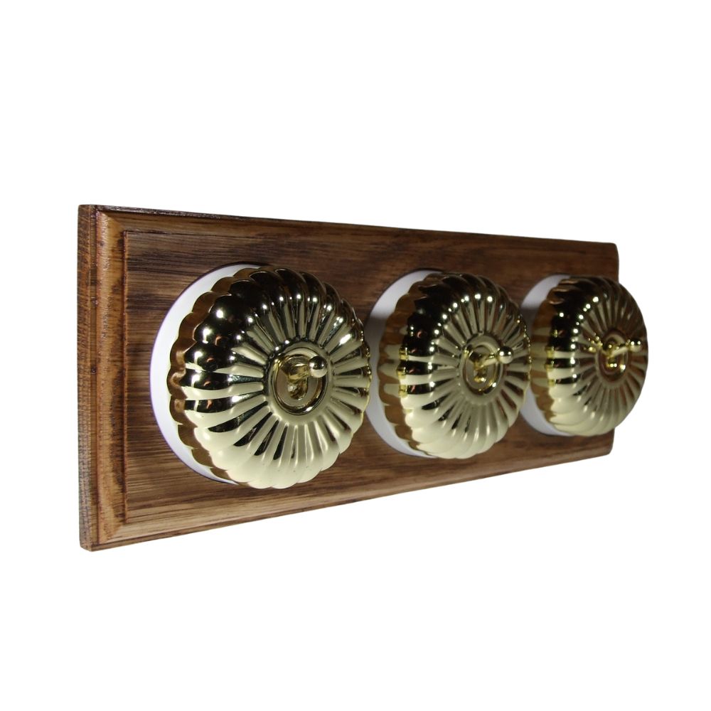 Period Fluted Polished Brass Dome Triple Dolly Light Switch Medium Oak White Horizontal