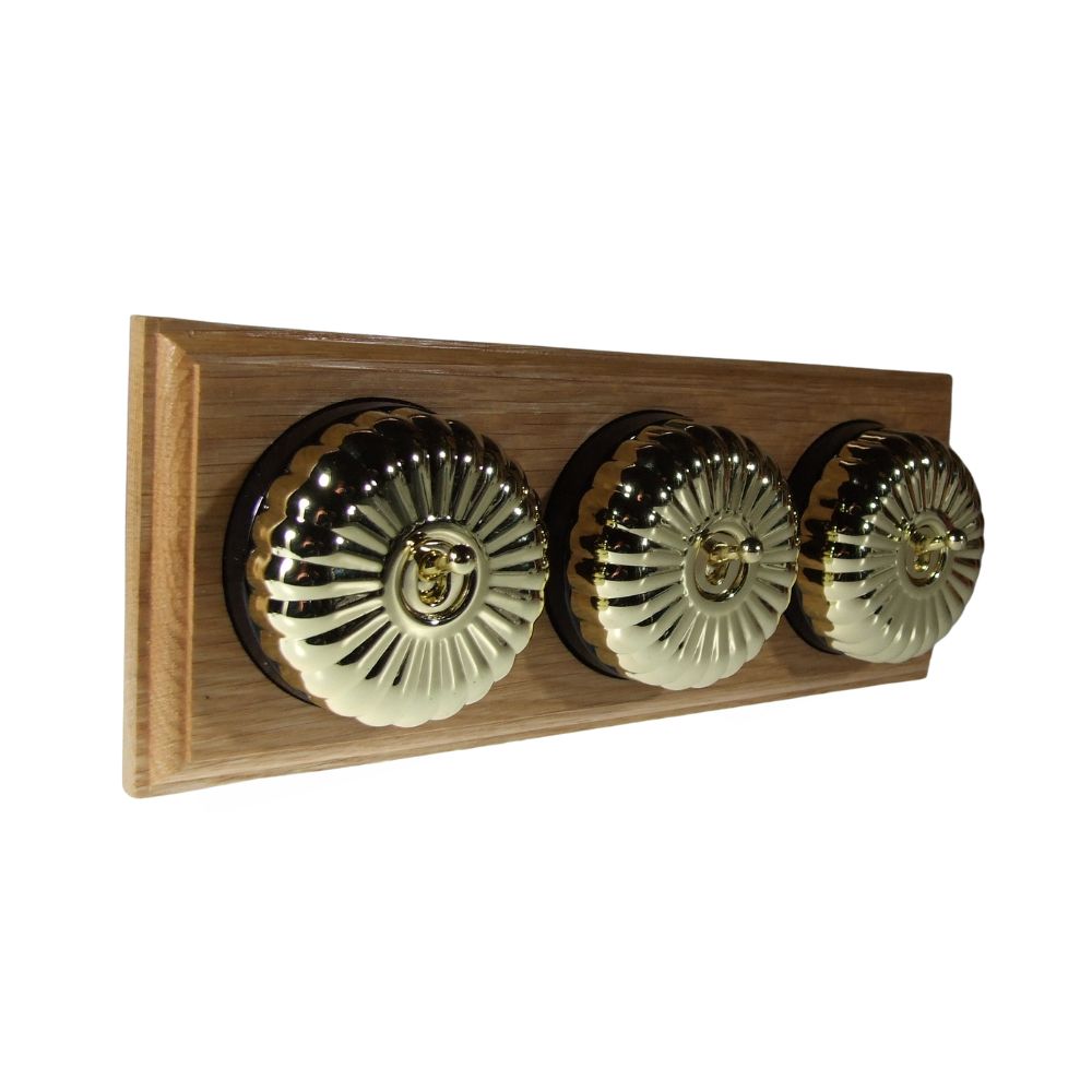 Period Fluted Polished Brass Dome Triple Dolly Light Switch Oak Black Horizontal