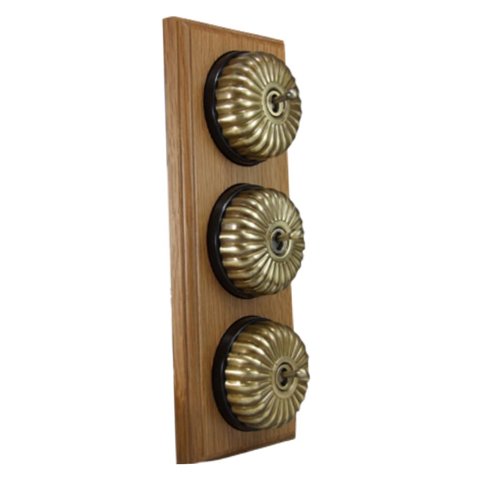Period Fluted Polished Brass Dome Triple Dolly Light Switch Medium Oak Black Vertical