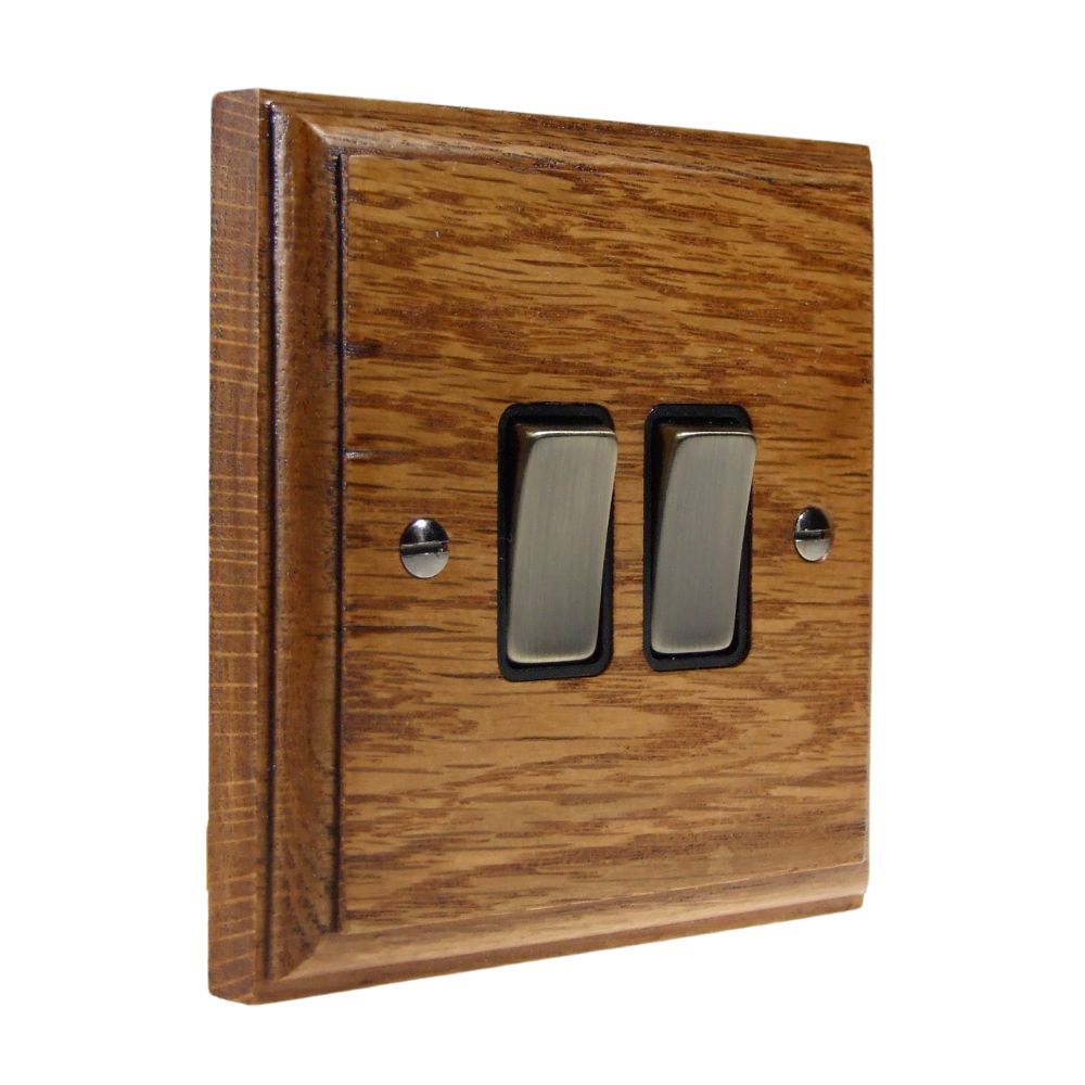 Classic Medium Oak Double Light Switch Antique Brass and Black