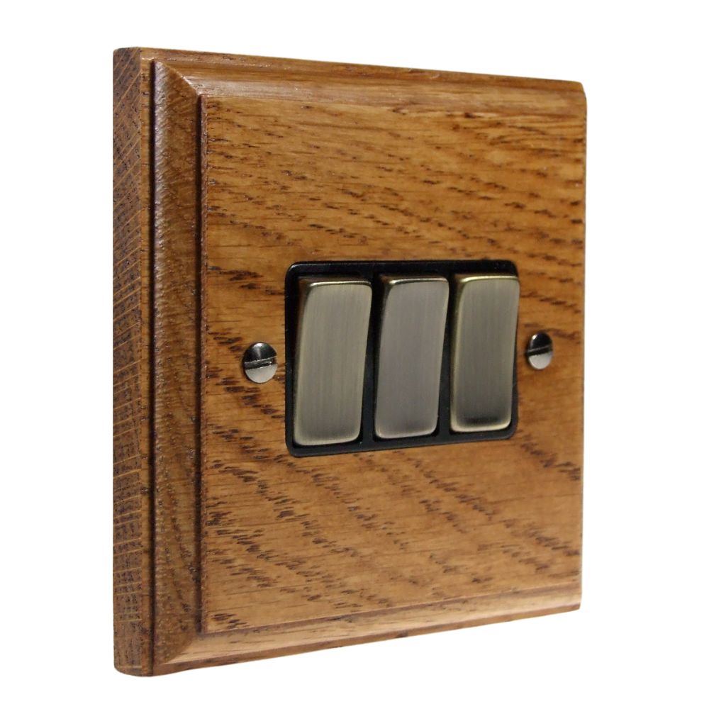 Classic Medium Oak Triple Light Switch Antique Brass and Black