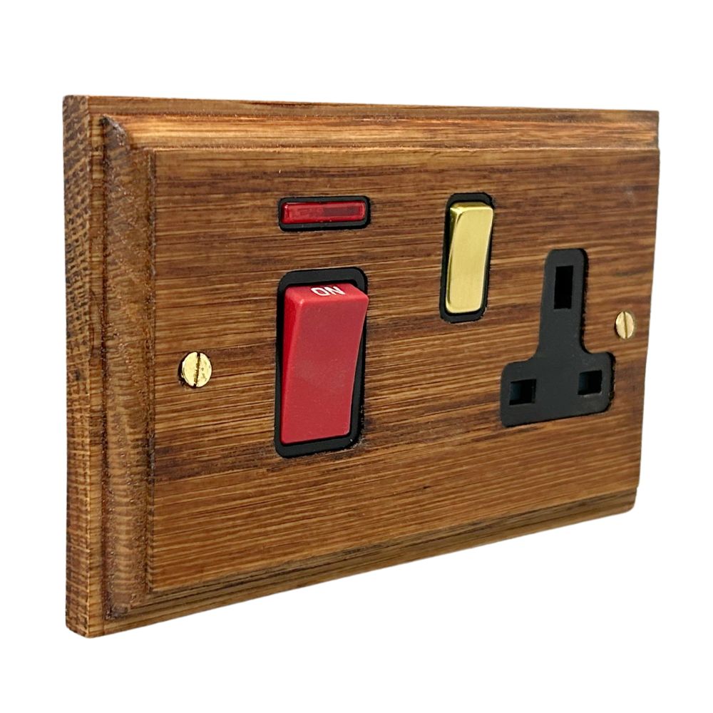Classic Medium Oak Double Pole Cooker Switch with Single Switched Socket Polished Brass and Black
