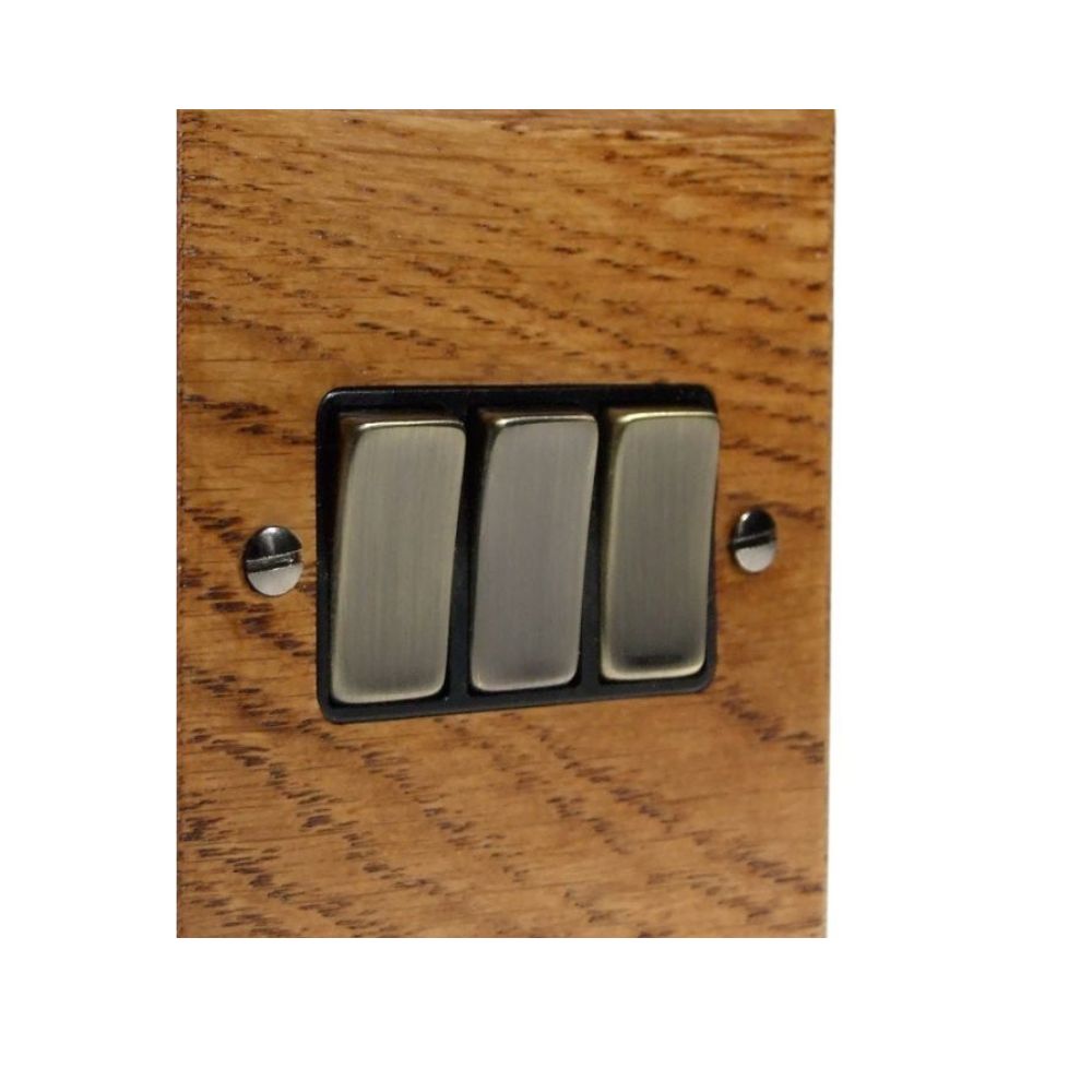 Bevelled Medium Oak Triple Light Switch Antique Brass and Black